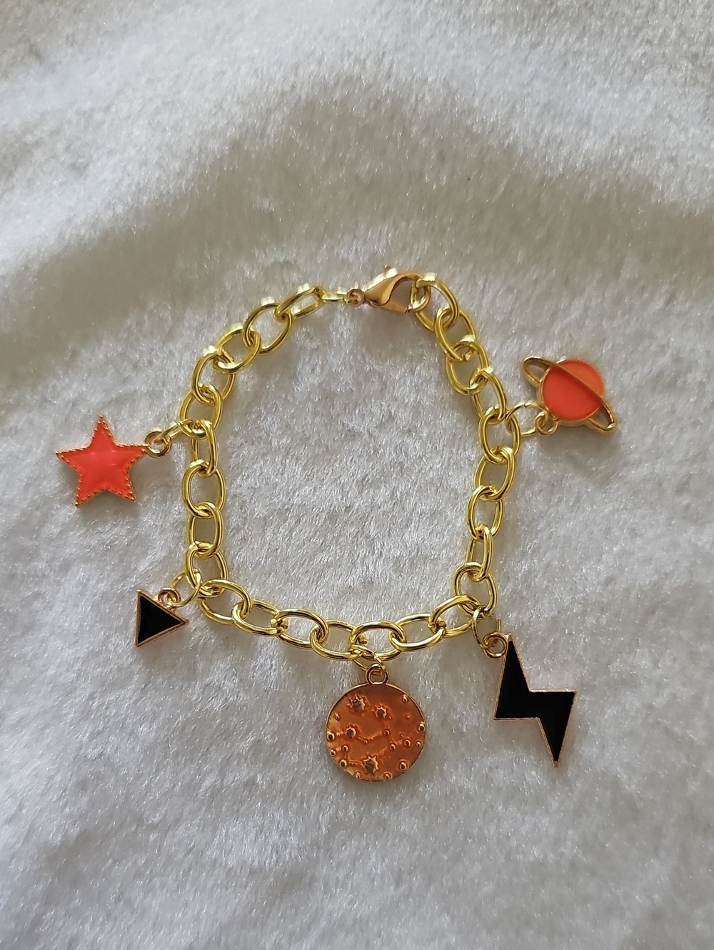 Gold Space Themed Charm Bracelet with Orange and Black Accents
